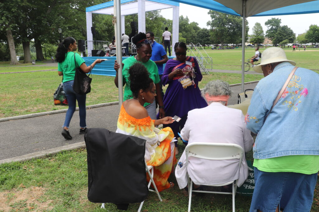 A group of people sitting around in chairs.